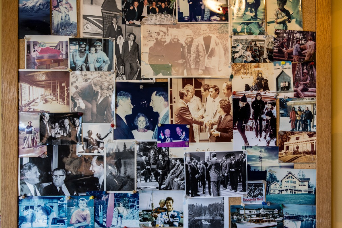 A snapshot of a wall of photographs of mountaineering legend Jim Whittaker
