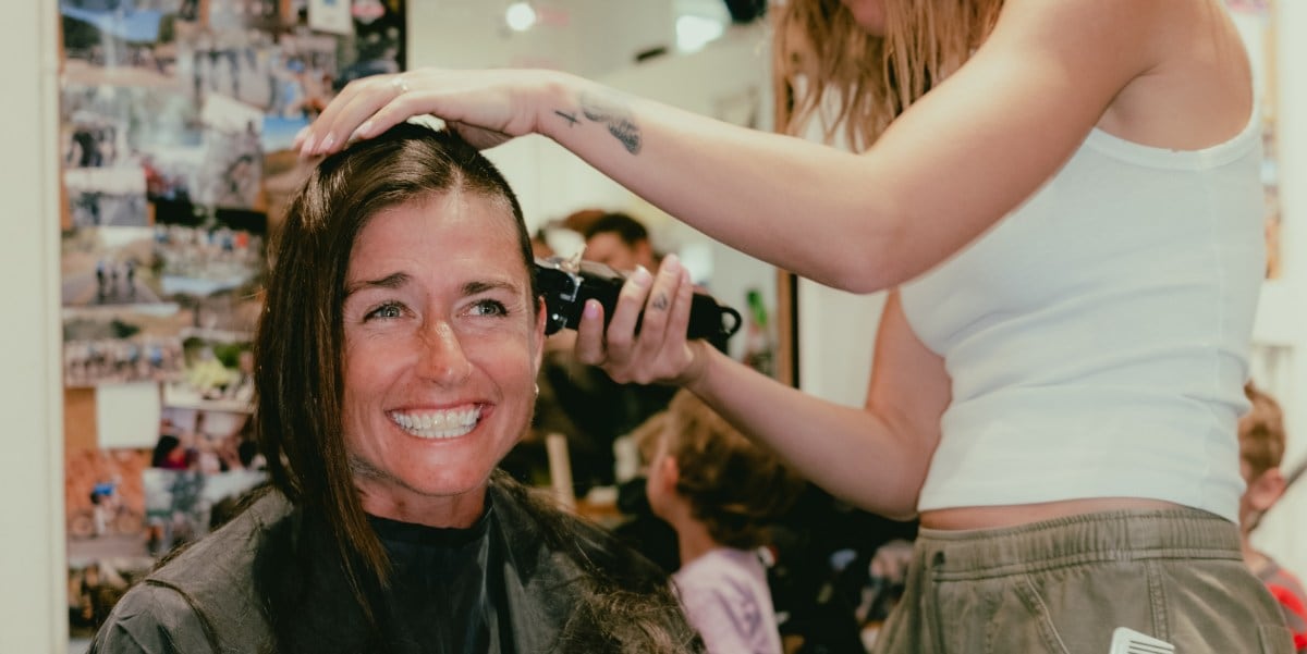 A woman getting her head shaved
