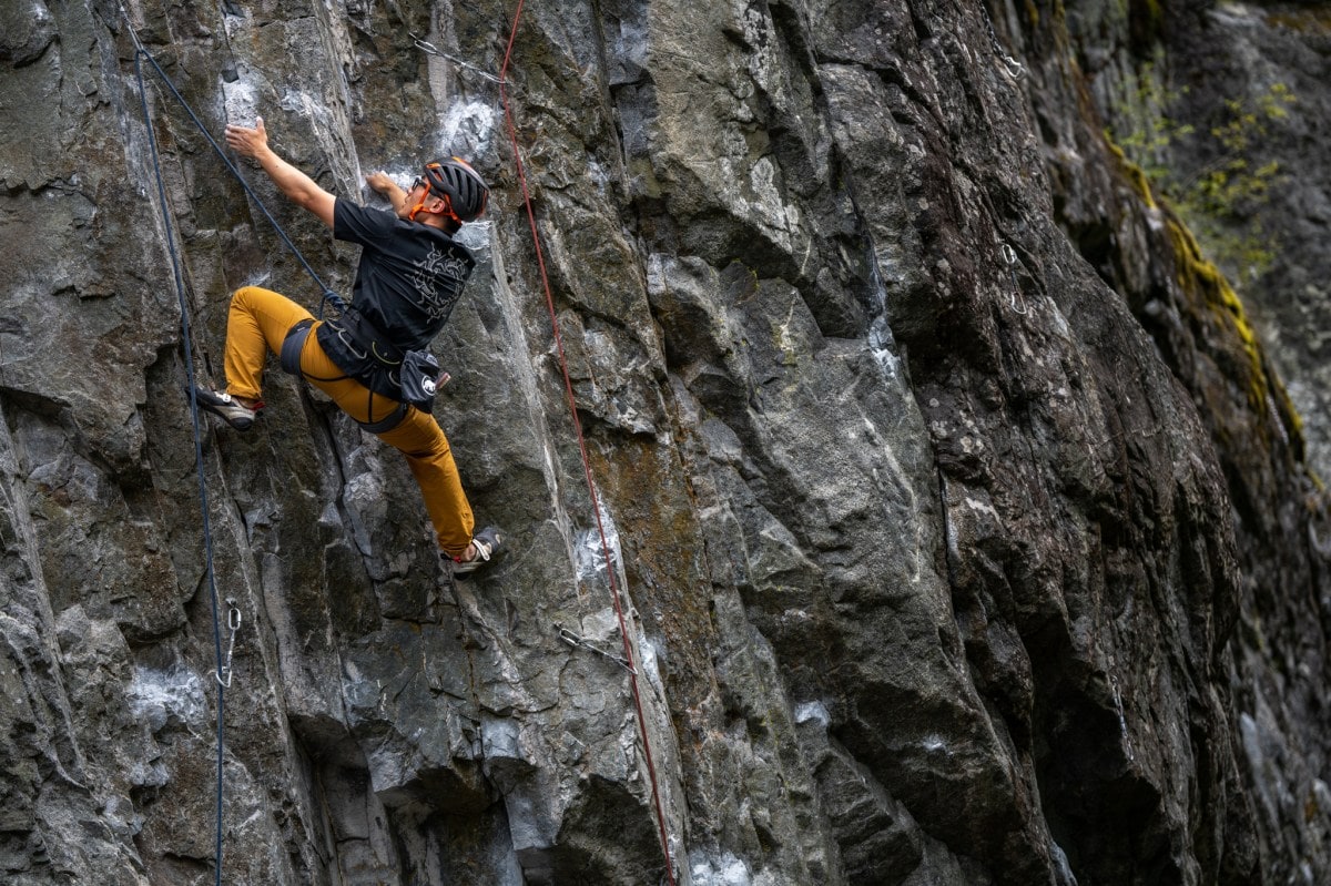 A climber on granite rock at the Arc'teryx Climb Academy in Squamish, British Columbia