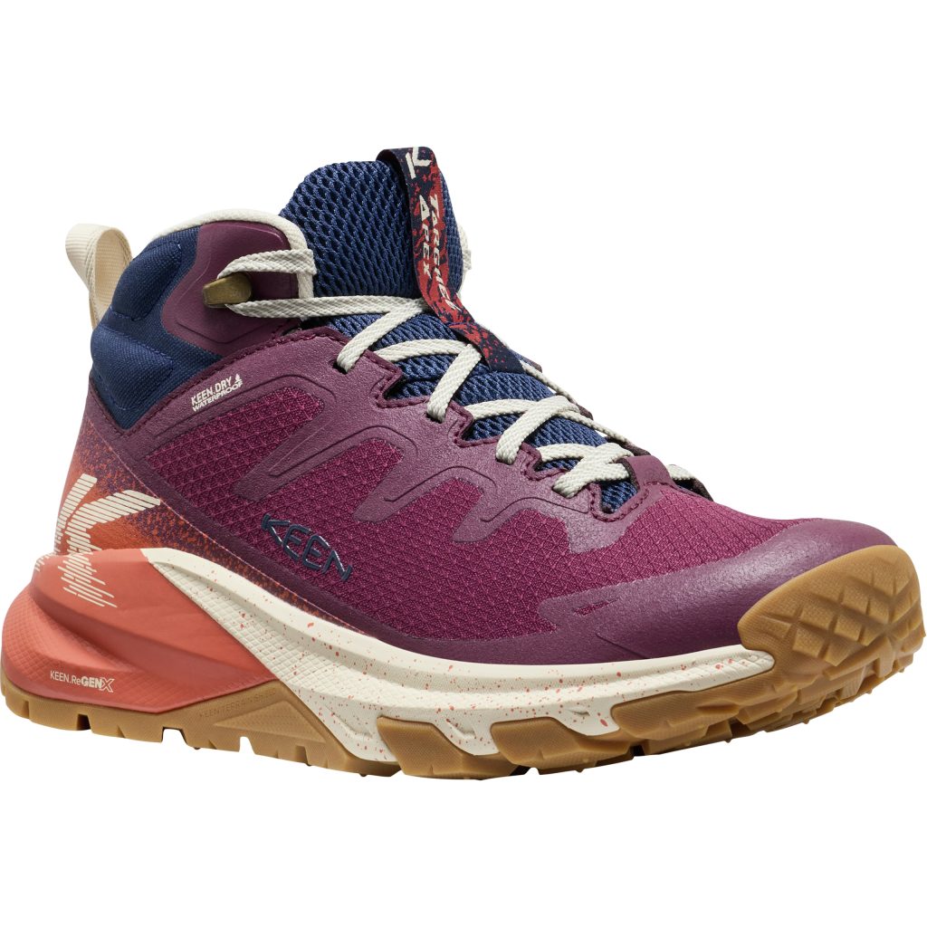 A purple and blue hiking shoe with a mid-cut collar on a white background