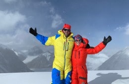 Rob Lea and Caroline Gleich on top of a mountain for Wild Ideas Worth Living podcast
