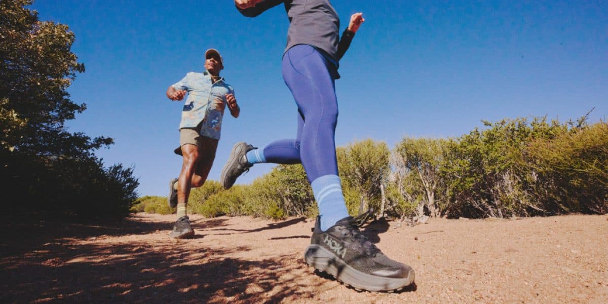 Two runners in the HOKA Challenger 8 trail-running shoes