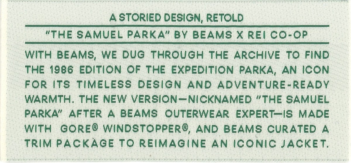A clothing label tells the story of the BEAMS x REI Co-op Expedition Parka