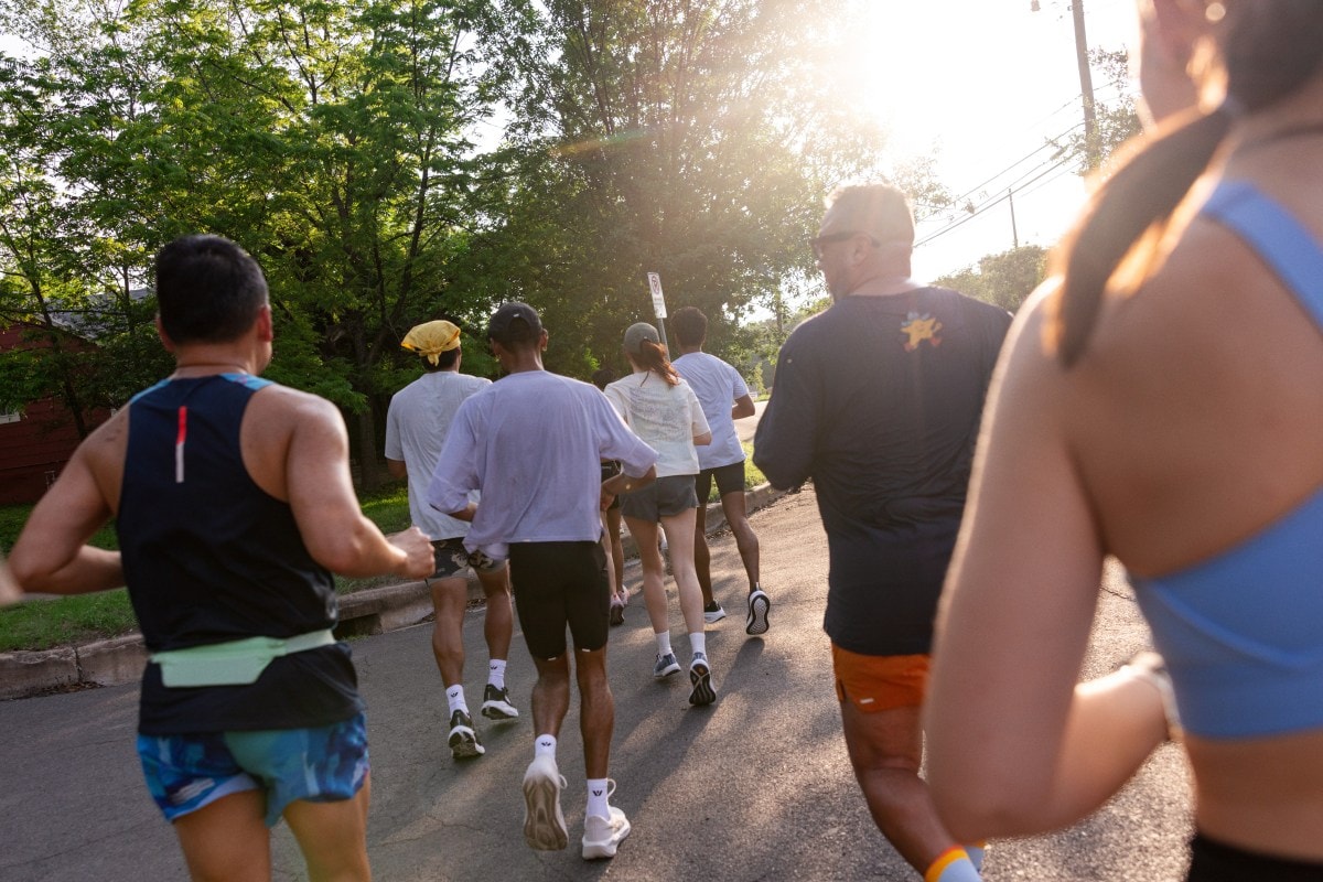 A group of people running on the road