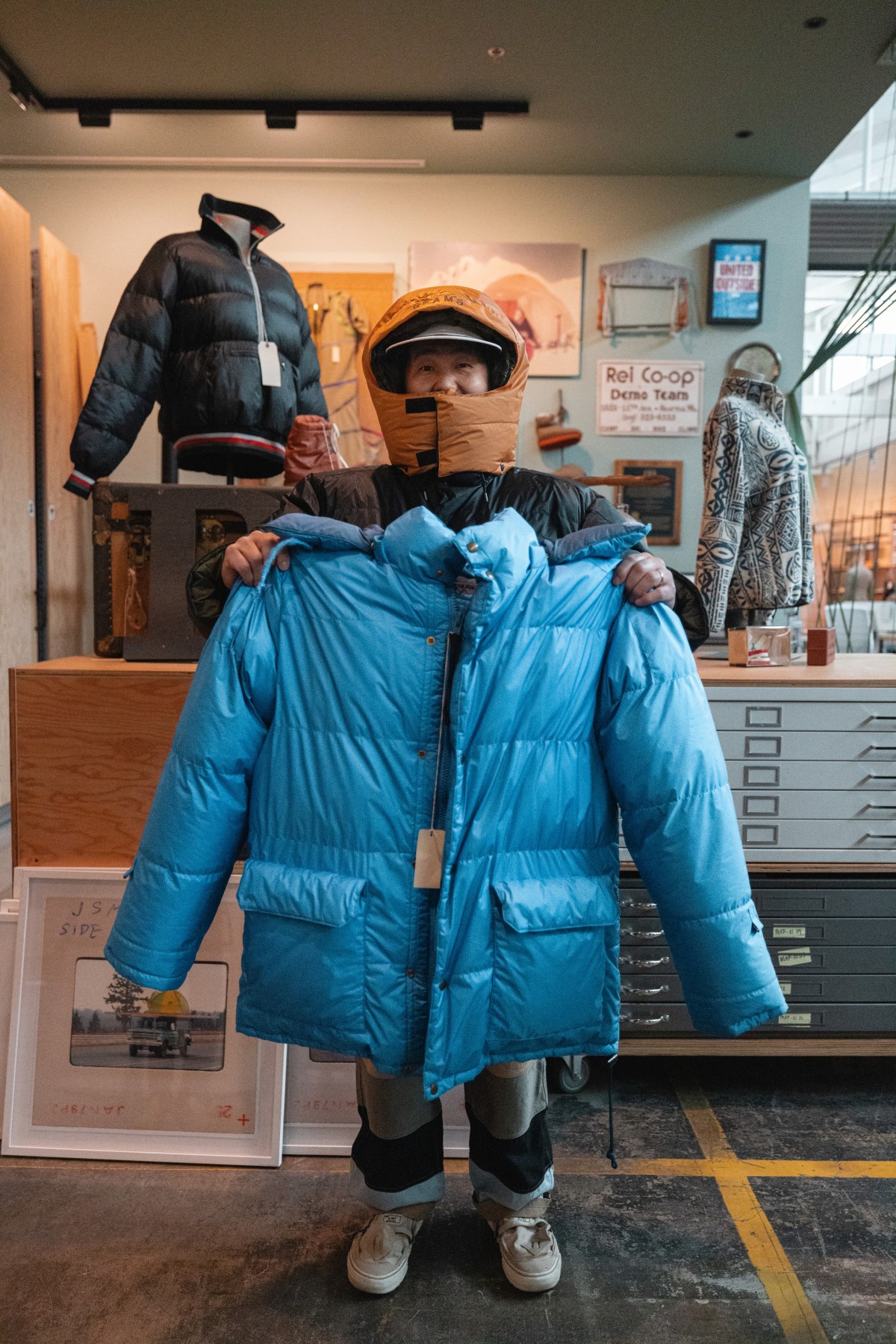 A person wears a bright blue down puffy