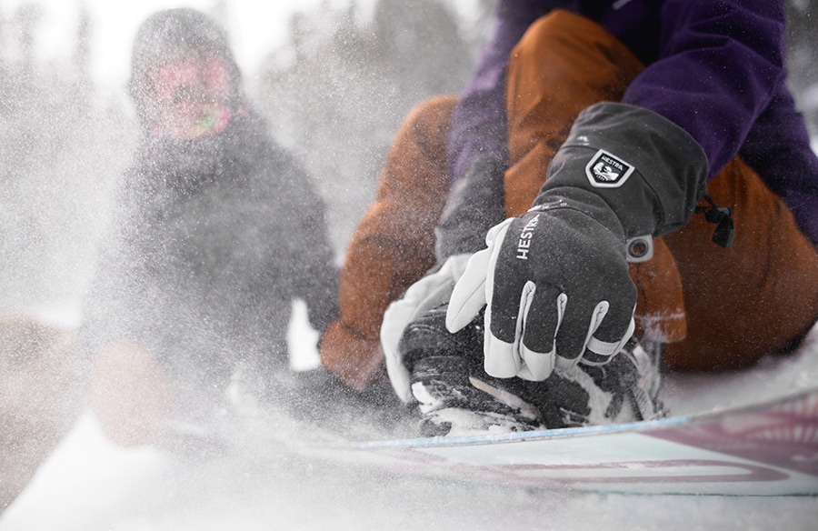 A snowboarder wearing Hestra Heli insulated gloves