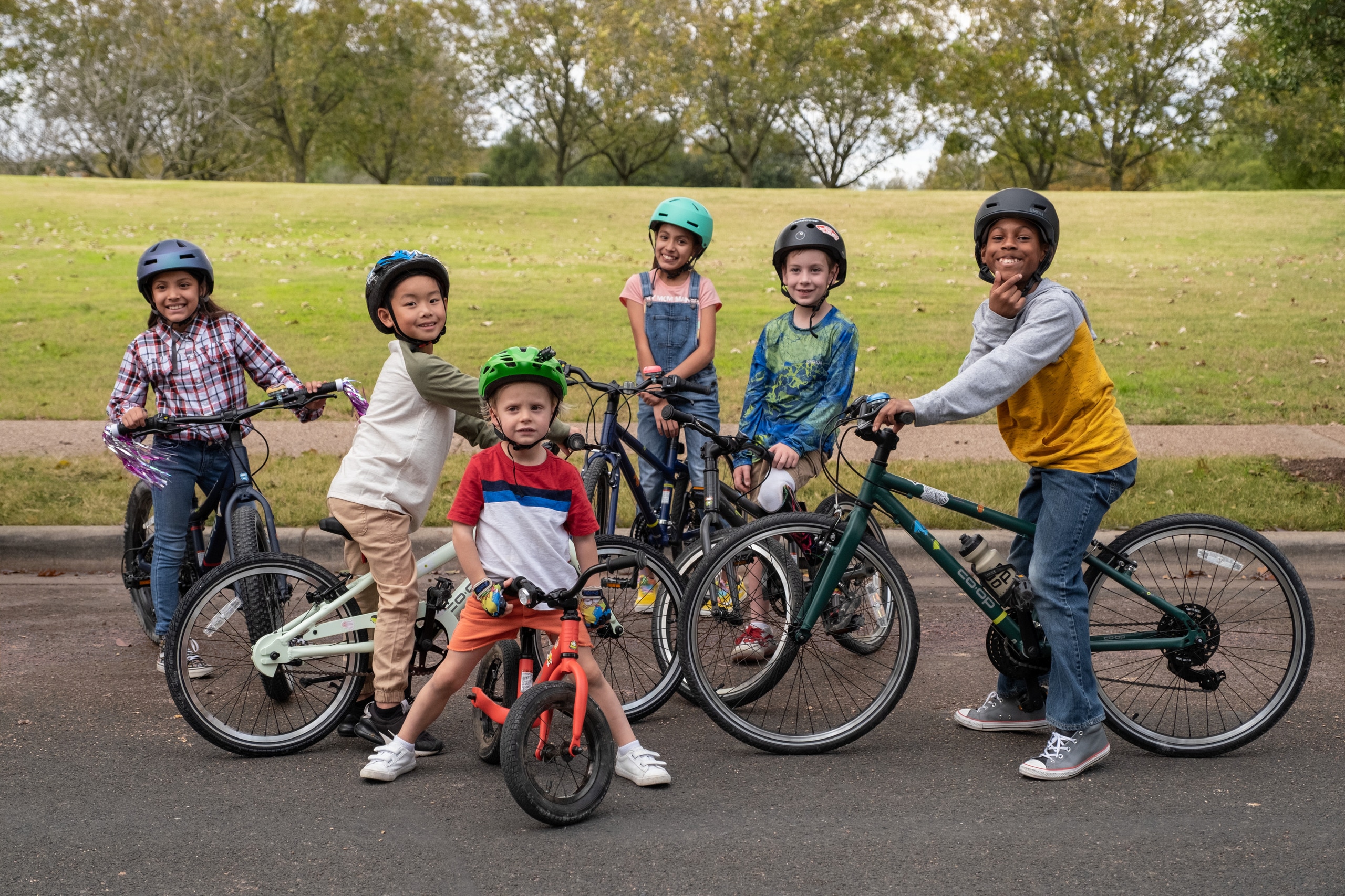 Group of kids on their bikes posing for the camera