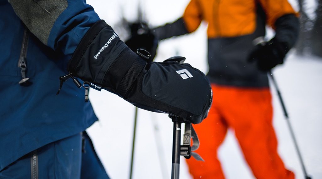 A skiers keeps hands warm with the Black Diamond Mercury Mittens.