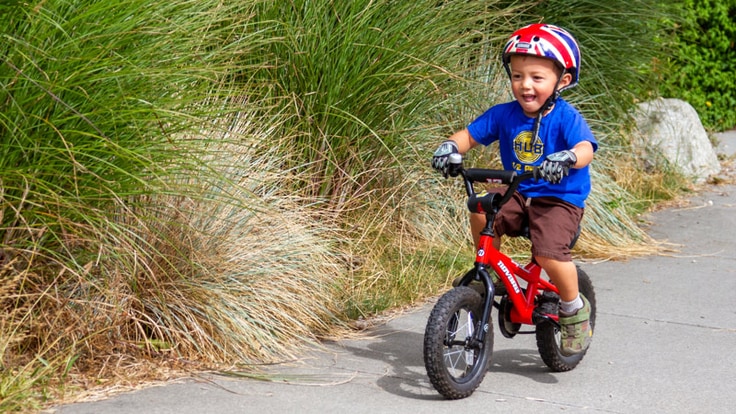 A small child riding a bike