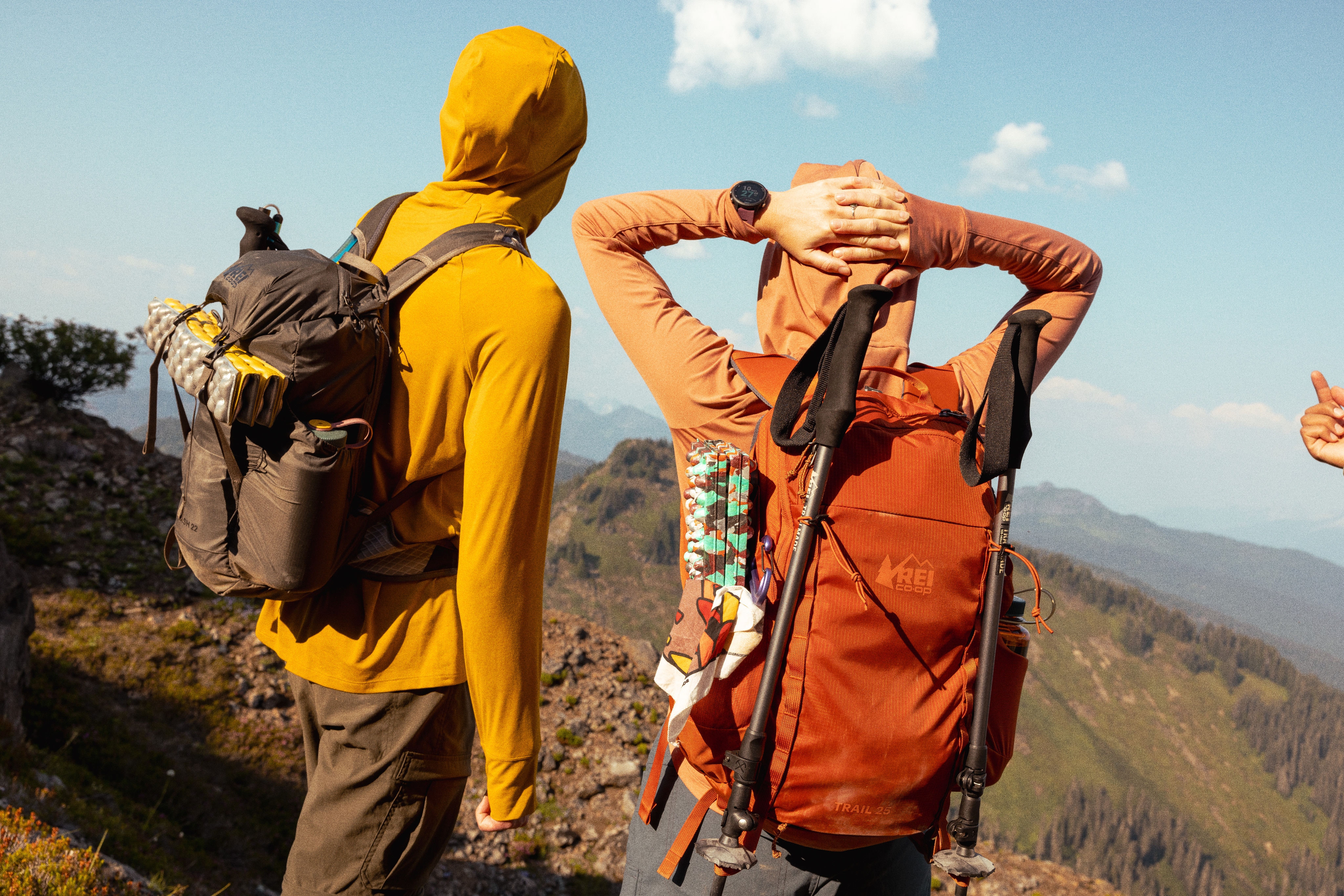 Two people stop to take in the view while on a hike.