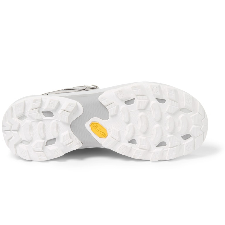 A side view of a Merrell hiking boot with its sole exposed.