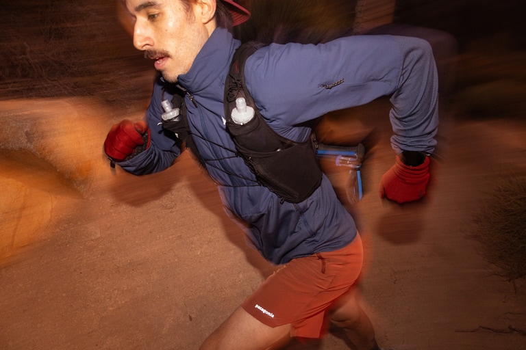 A runner wears an insulated jacket during a night run.