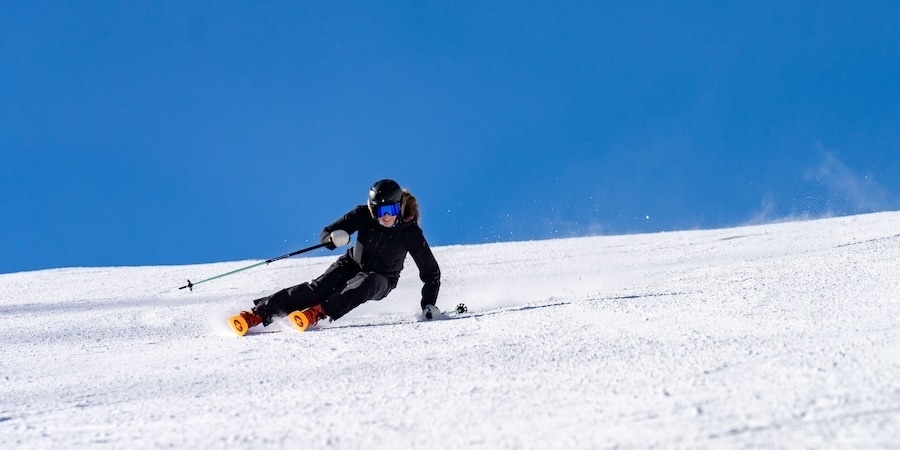 A woman skis a groomer on Blizzard's Black Pearl skis.