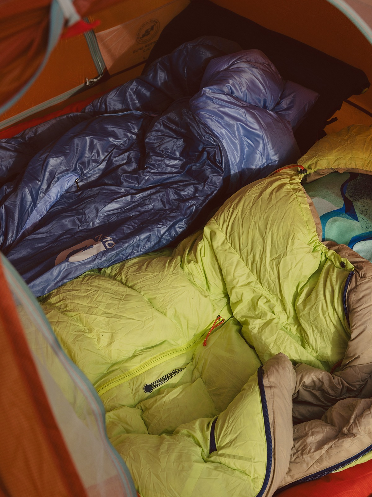 Two NEMO sleeping bags photographed inside of a tent.