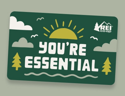 An R E I Co-op gift card that reads, 'You're essential', with images of the sun, clouds, and trees.