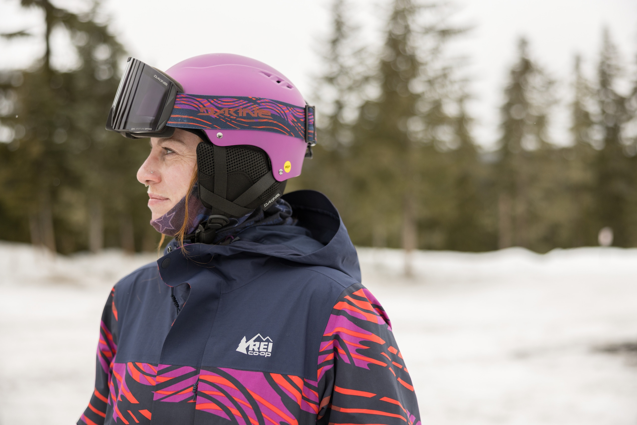 A person wears a ski jacket, helmet and goggles