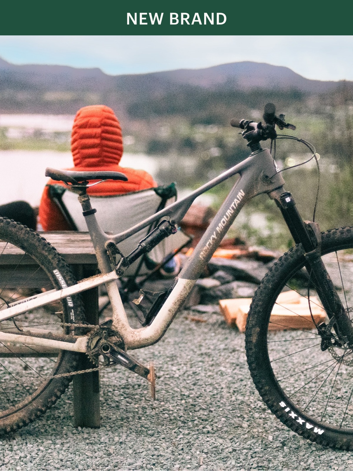 A Rocky Mountain bike leans against a table at a campsite.