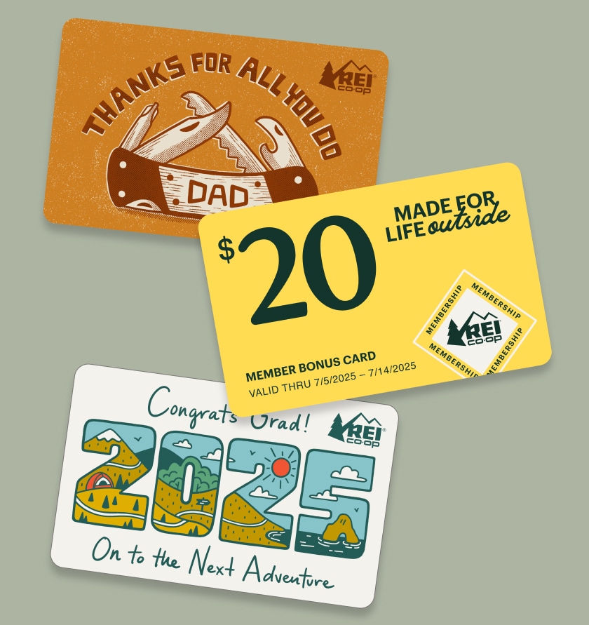 A $20 member bonus card that reads 'Made for life outside,' an R E I gift card that says 'Thanks for all you do dad' and an R E I gift card that reads 'Congrats grad! On to the next adventure.'