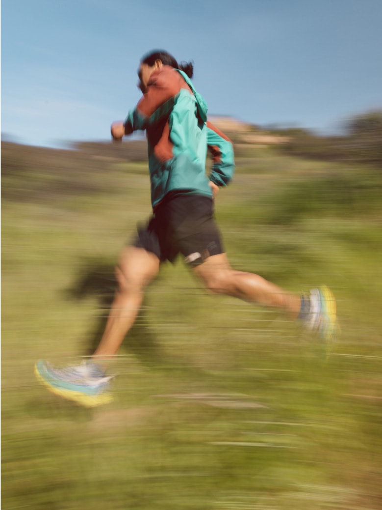 A trail runner jogs by.