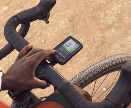 A person stops their ride to check out their Wahoo GPS bike computer.