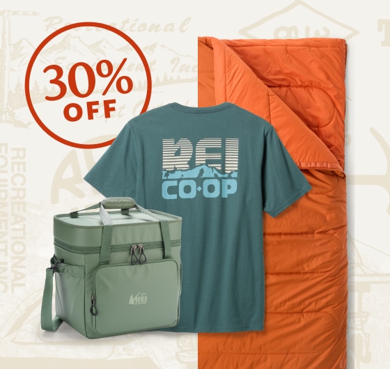 A t-shirt, sleeping bag, and cooler bag from the R E I Co-op brand.