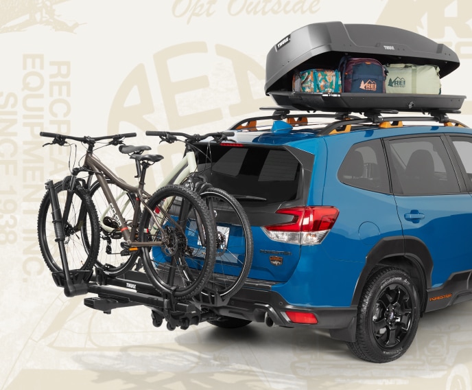 A car rack with two bikes on it.