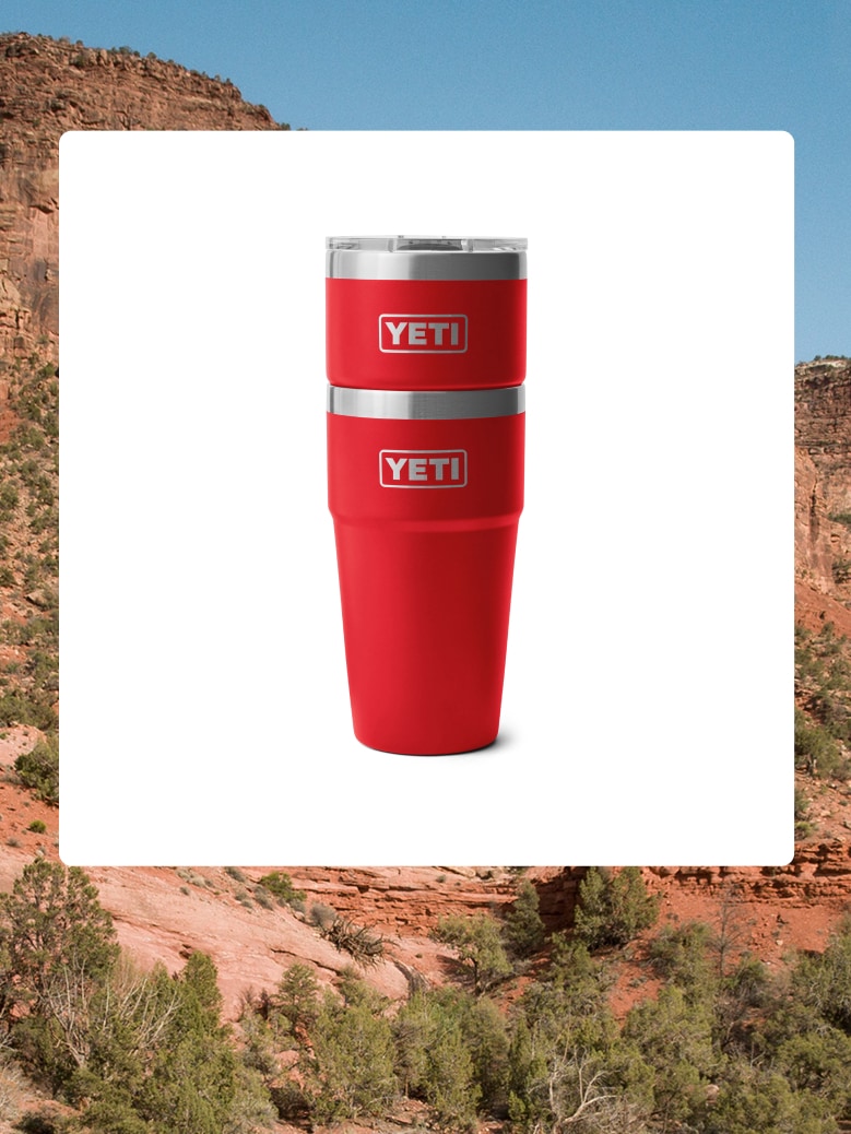 Stackable YETI cups over an image of a desert canyon.