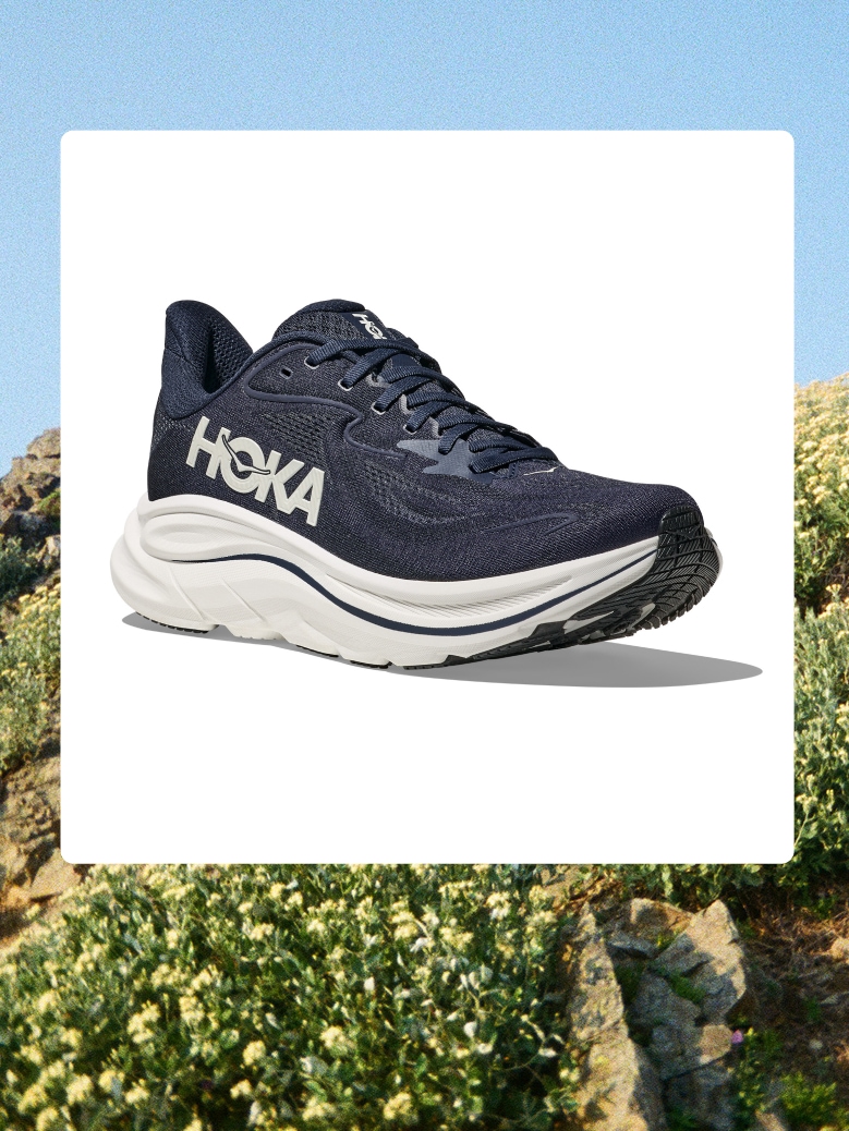 A HOKA running shoe over an image of greenery.
