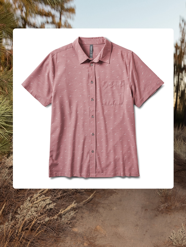 A Vuori button-down shirt over an image of a body of water.