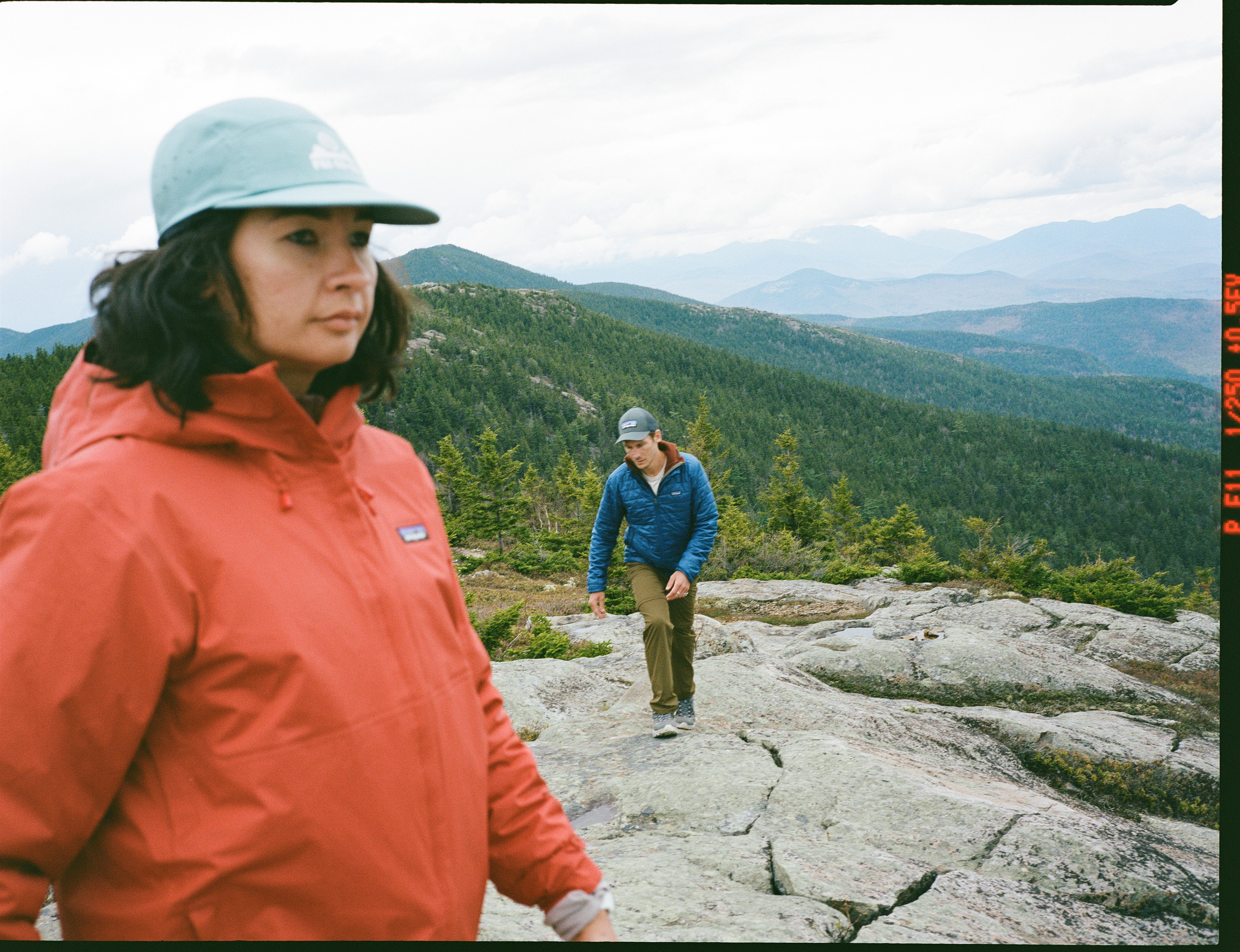 A person wears the Patagonia Torentshell Jacket
