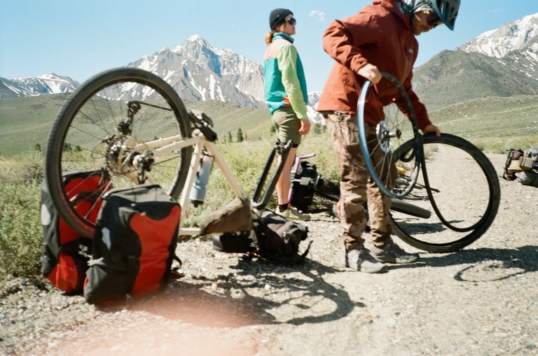 Cyclists replace a bike tire