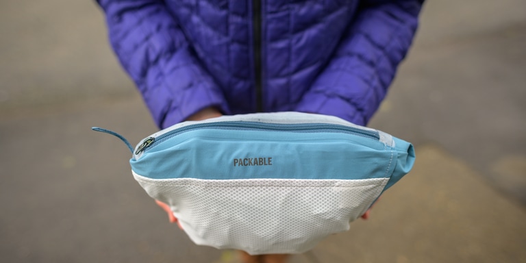 A rain jacket packs away into its own pouch