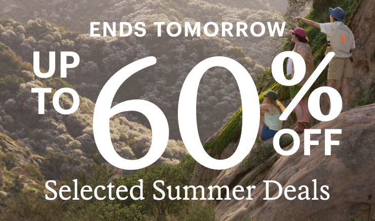 Three friends on boulder, pointing to admire something in the vista out of frame. Headline: ENDS TOMORROW UP TO 60% OFF Selected Summer Deals
