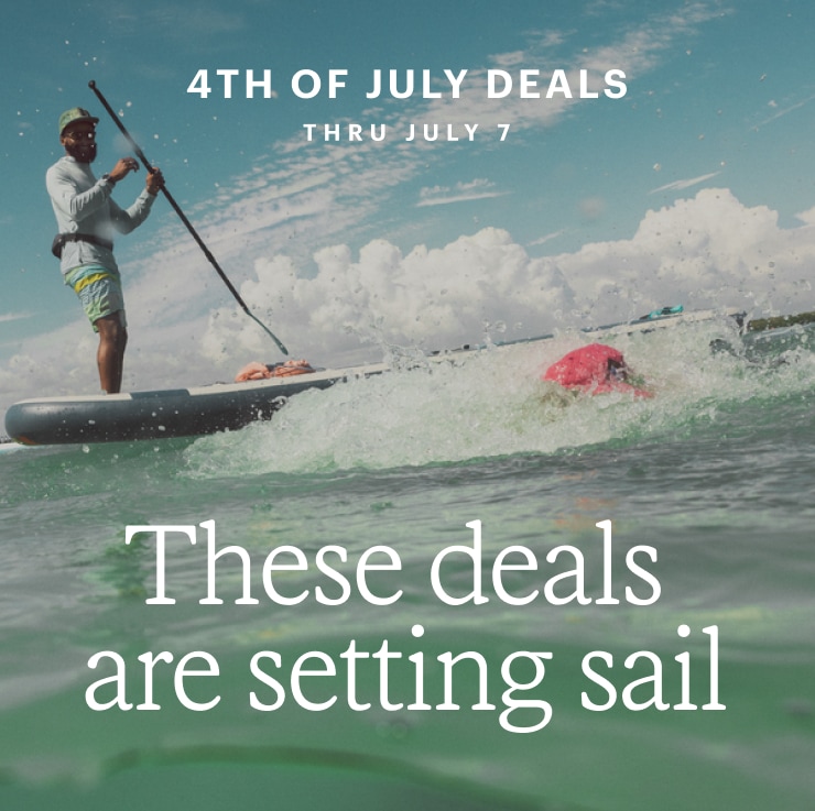 A stand up paddle boarder on the water. Headline: These deals are setting sail. 4TH OF JULY DEALS THRU JULY 7