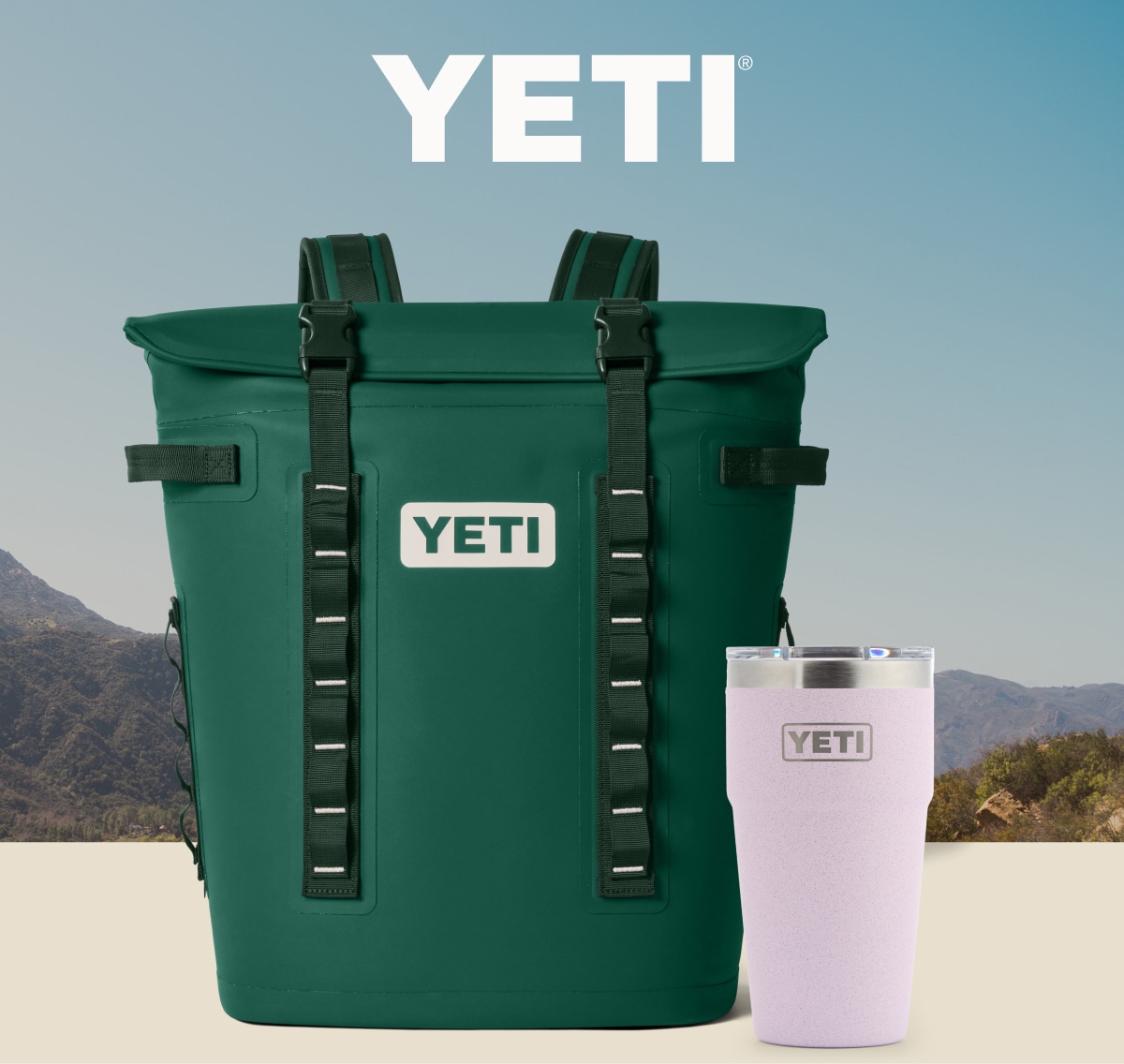 A cooler backpack and tumbler from YETI over an image of a mountain range.
