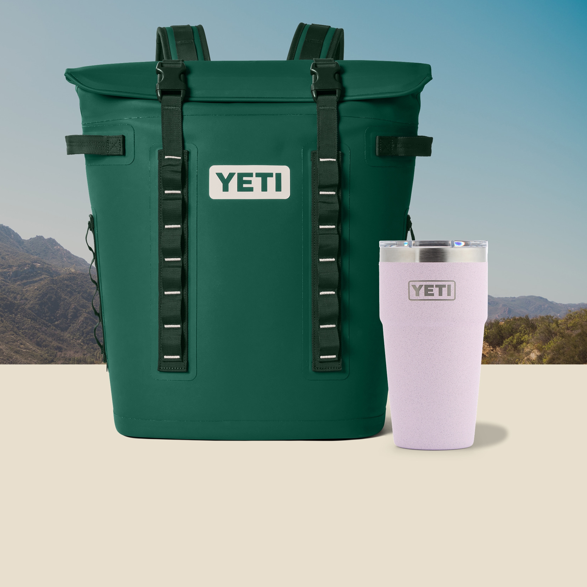 A green soft cooler backpack and a tumbler.