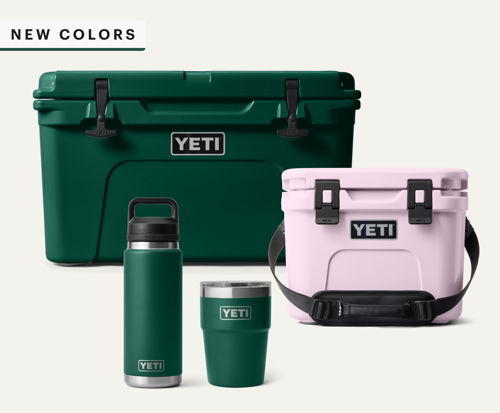 New colors. A group of YETI coolers and drinkware in Black Forest Green and Cherry Blossom.