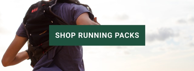 Back of person wearing running pack. SHOP RUNNING PACKS