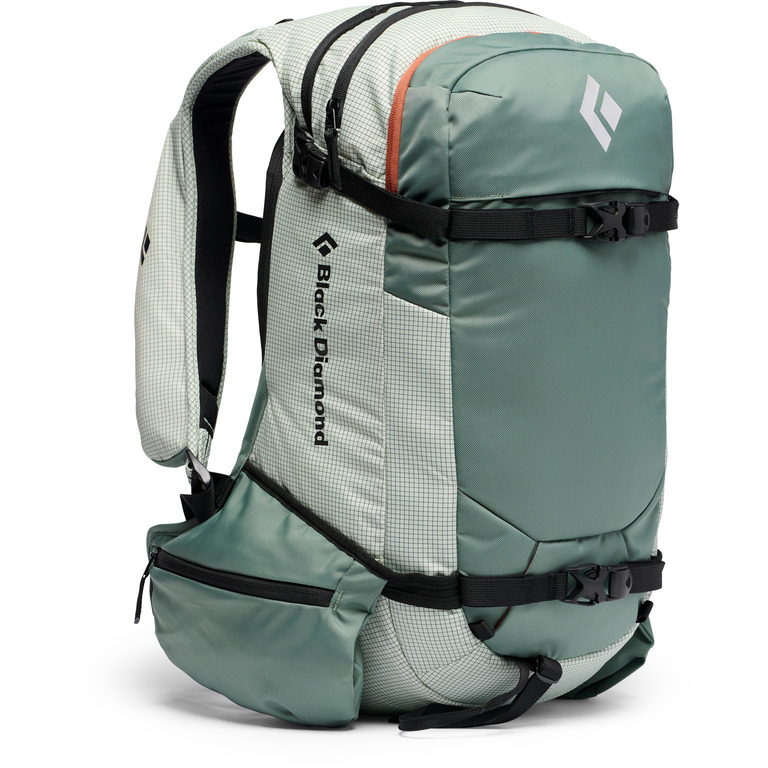 A green pack with black straps standing up against a white background