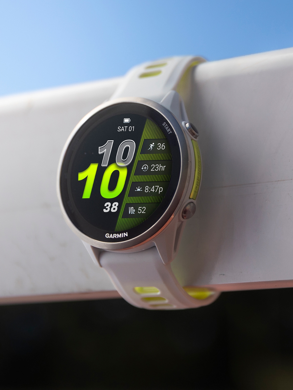 A Garmin watch with a blue sky in the background.
