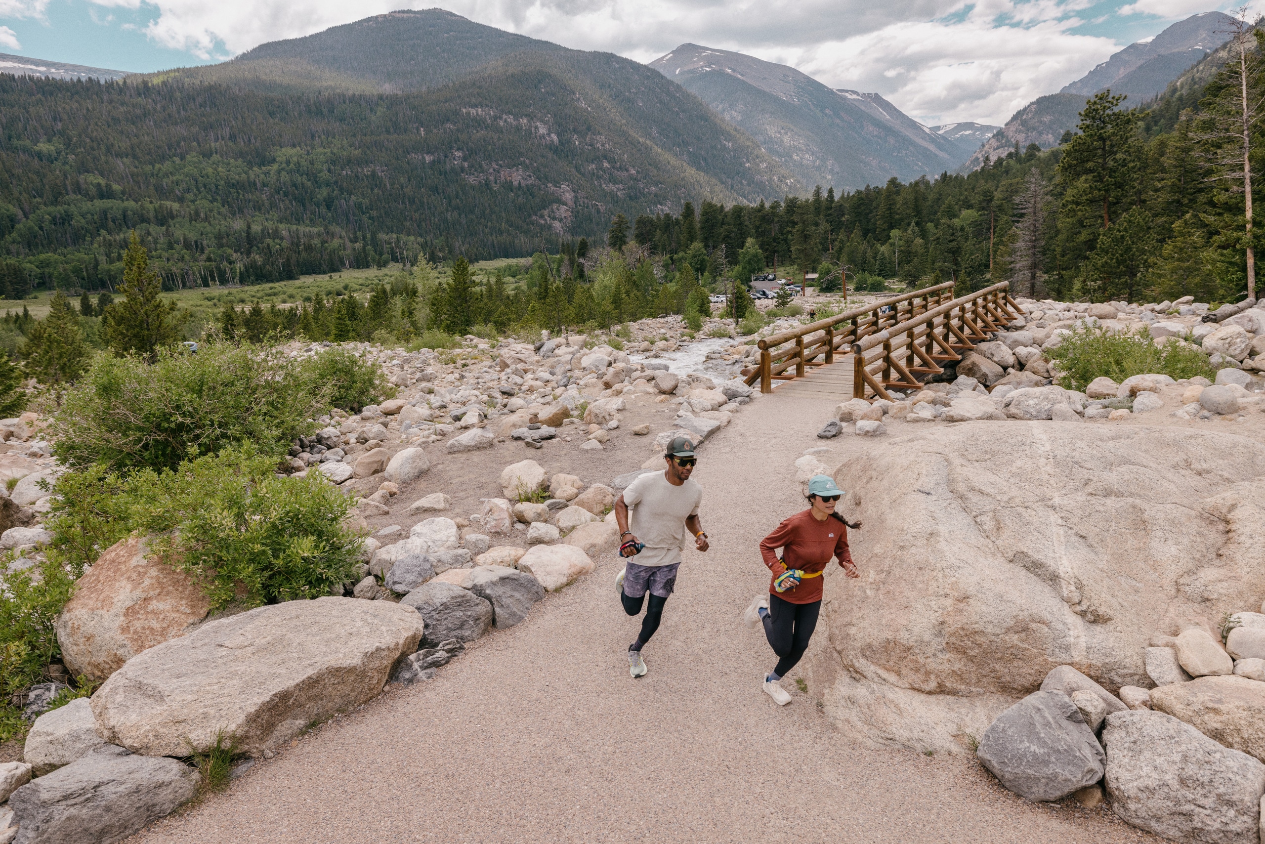 Two people running on a trail