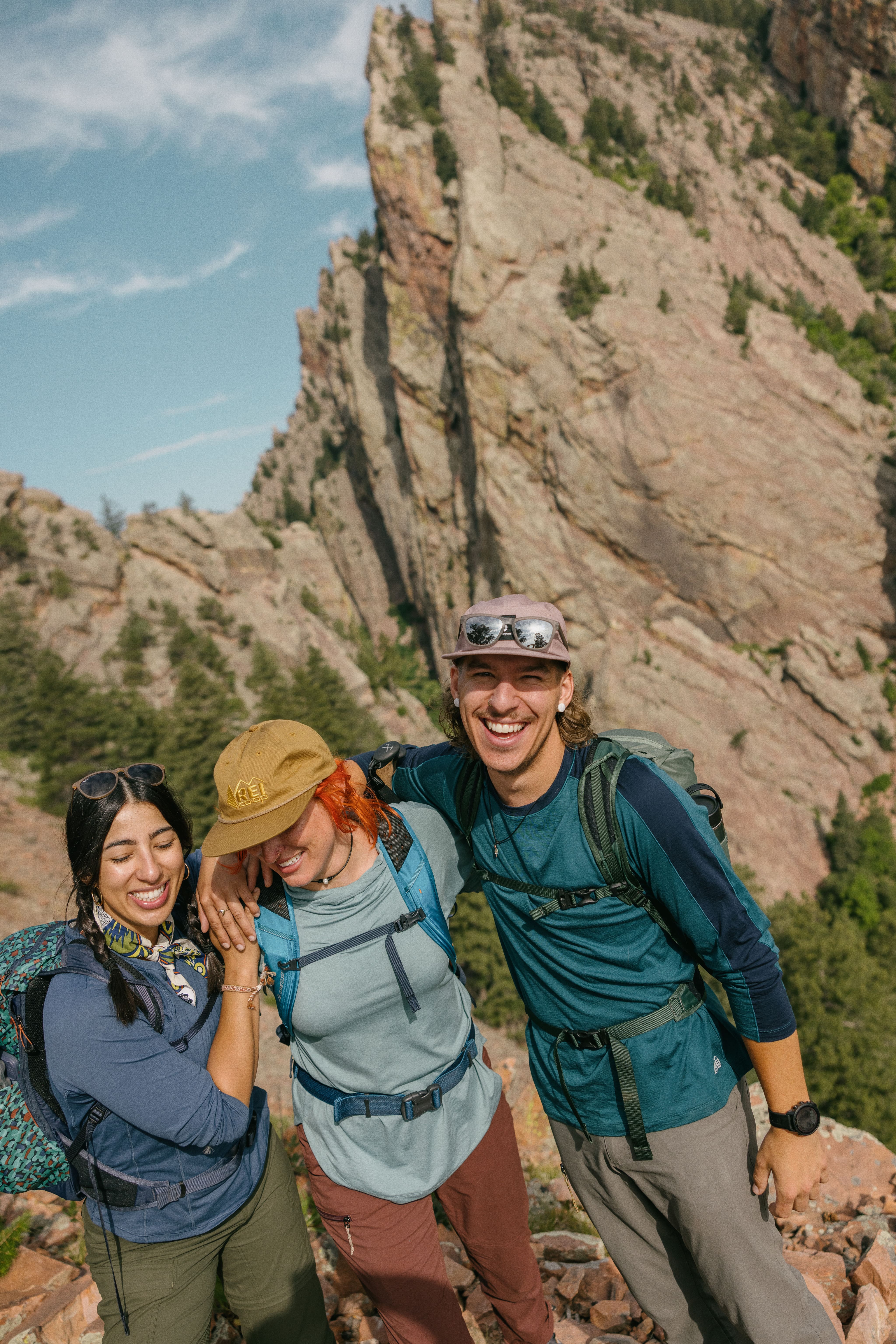 Three friends pose for a photo