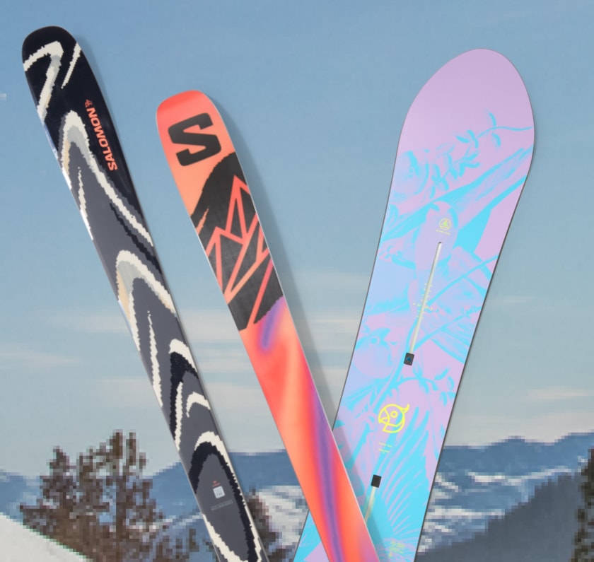 Colorful skis and a snowboard over an image of snowy mountains.