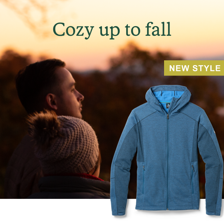 Couple watches sunset together. Headline: Cozy up to fall