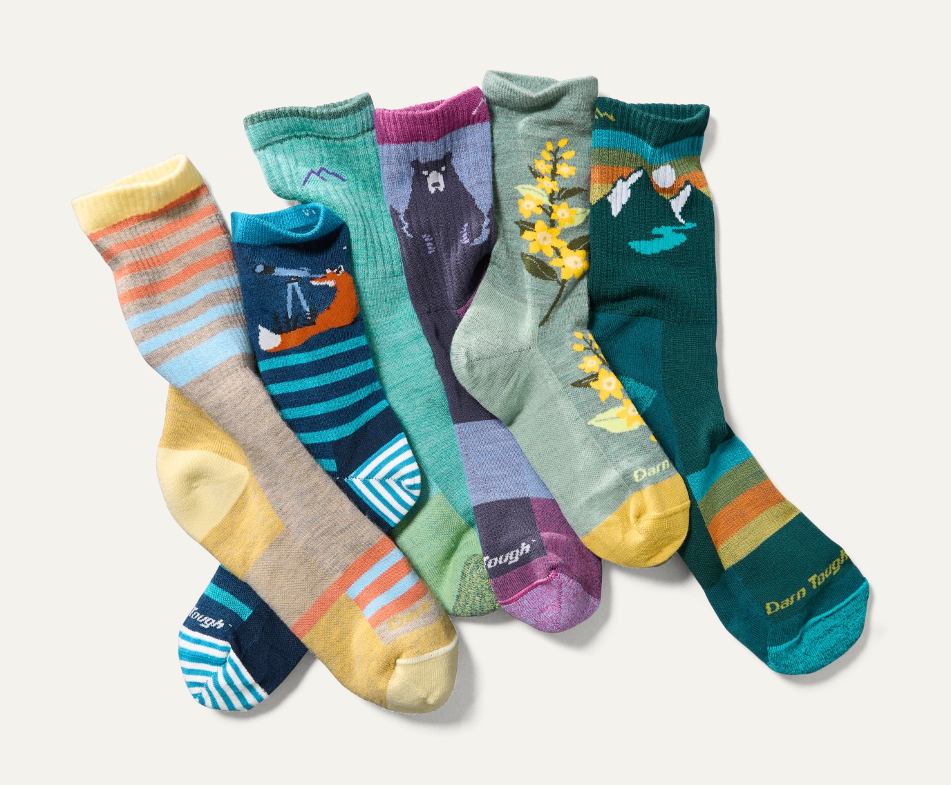 A collage of colorful printed socks from Darn Tough.