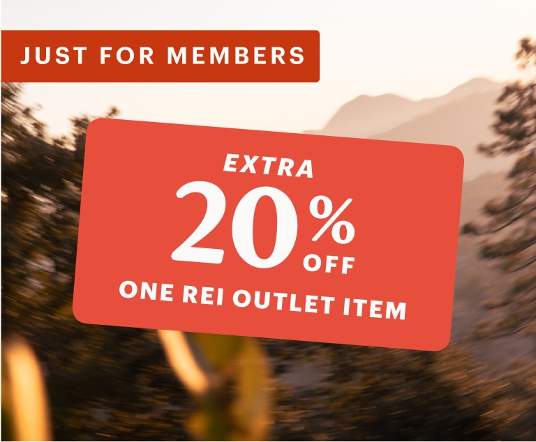 A 20% off member coupon over an image of trees with mountains in the background.