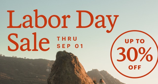 Two explorers posing atop a crag. Headline: Labor Day Sale. THRU SEP 1. UP TO 30% OFF
