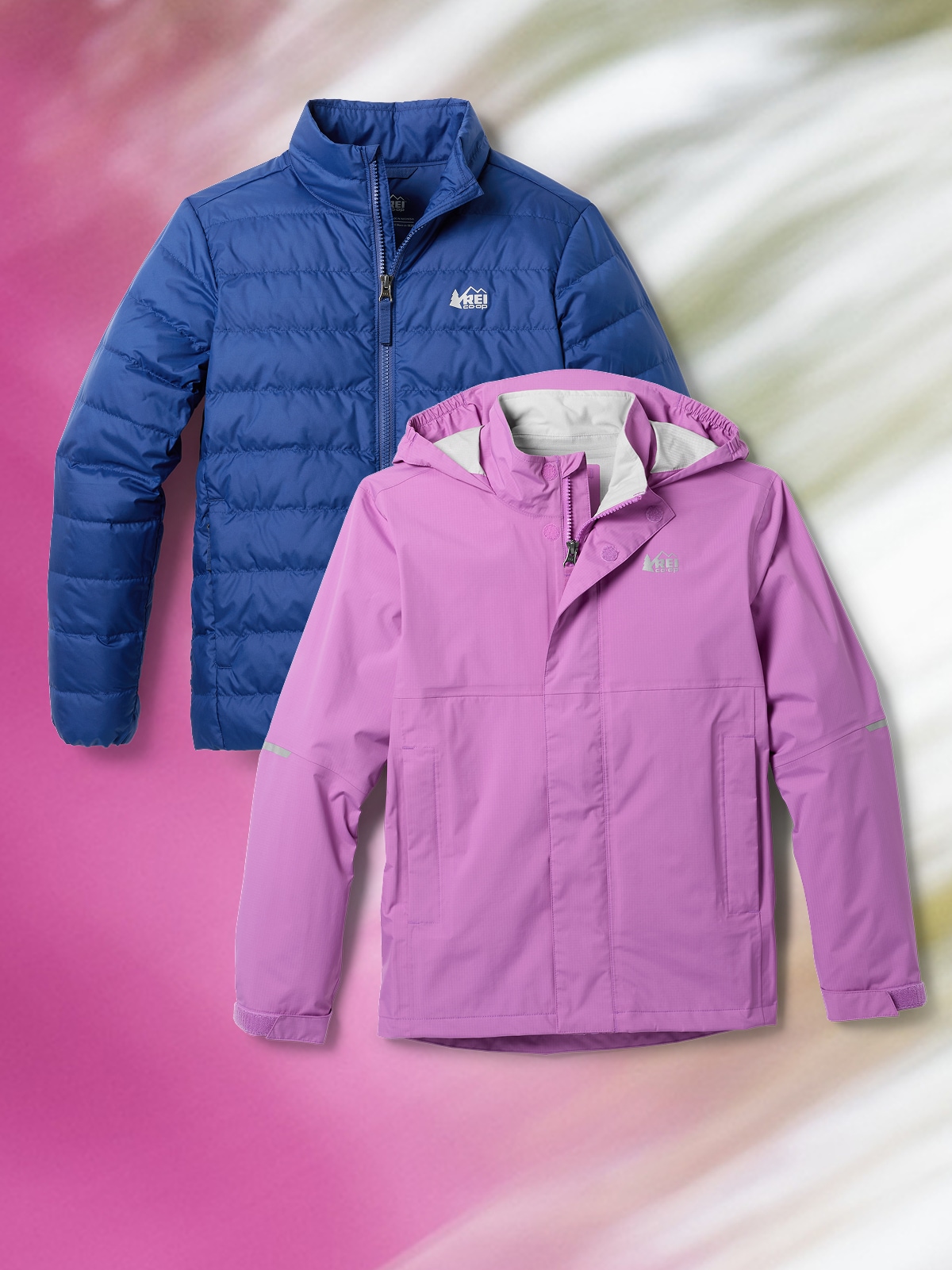 Two R E I Co-op kids jackets over a colorful green and pink background.