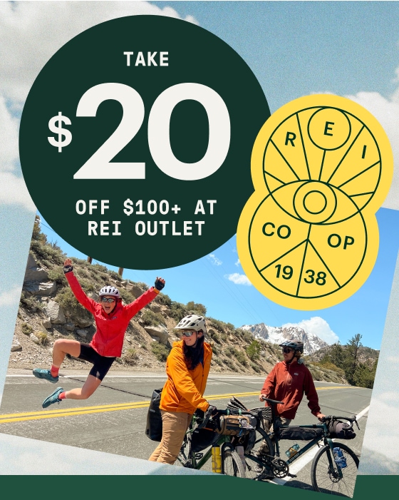 Save 20 dollars when you spend 100+ dollars at R E I Outlet during Member Days. A group of people gather before a bike ride.