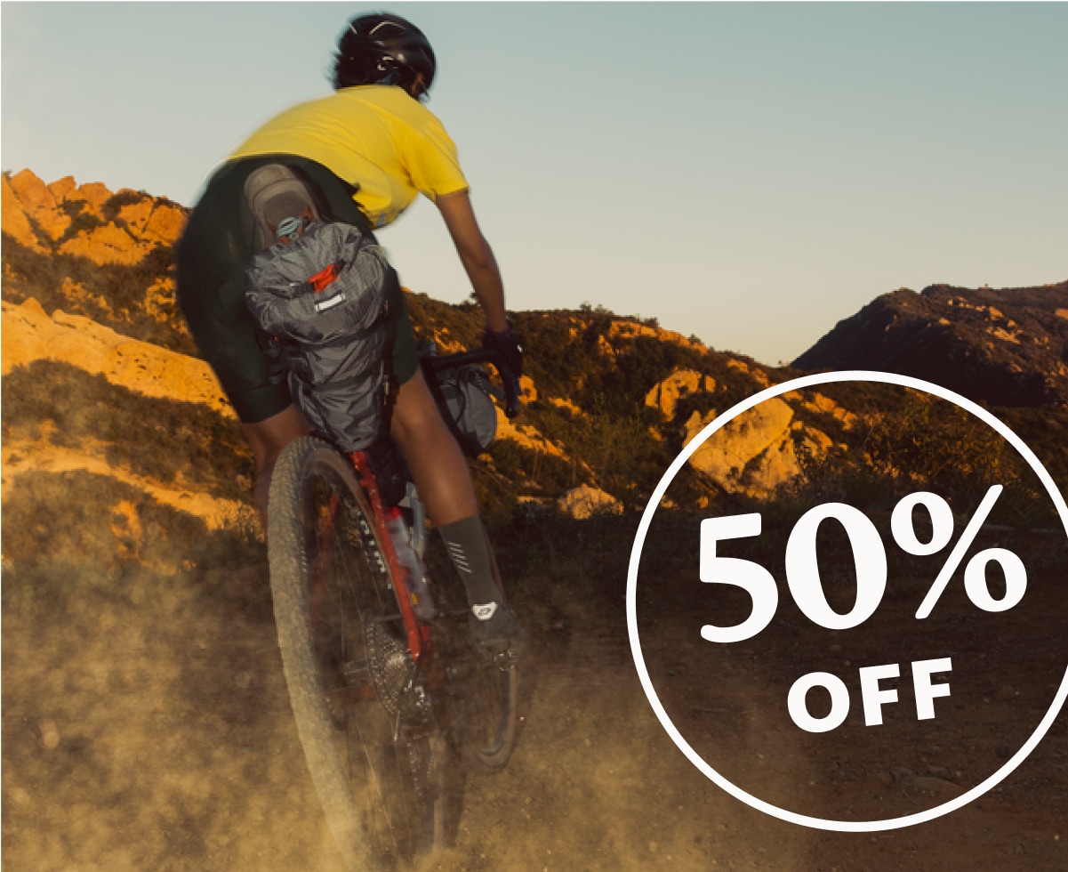 A person rides a bike up a mountain path.